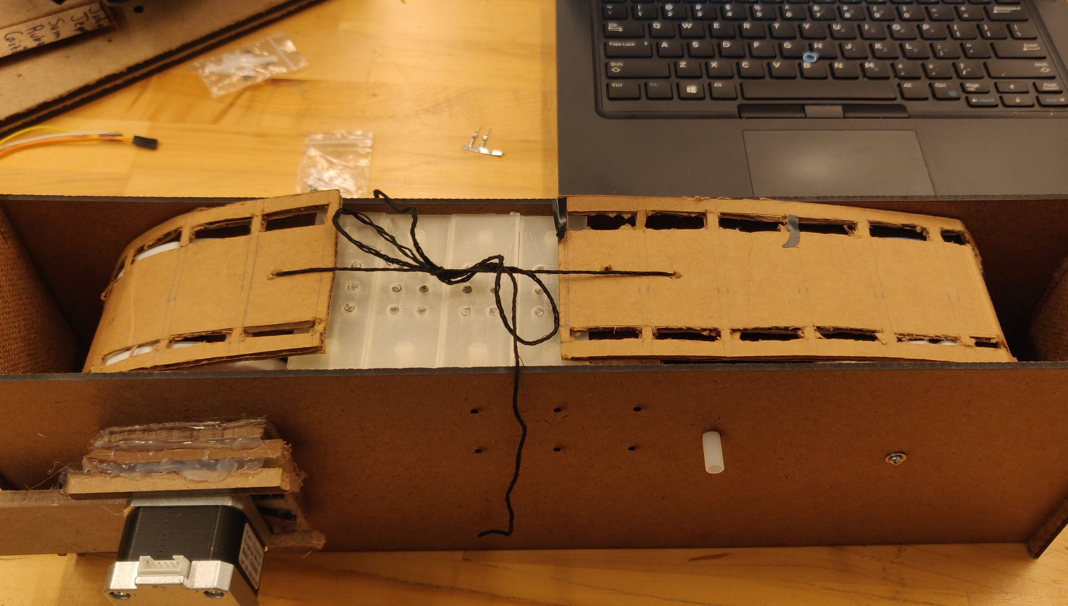 Cardboard belt in fiberboard housing