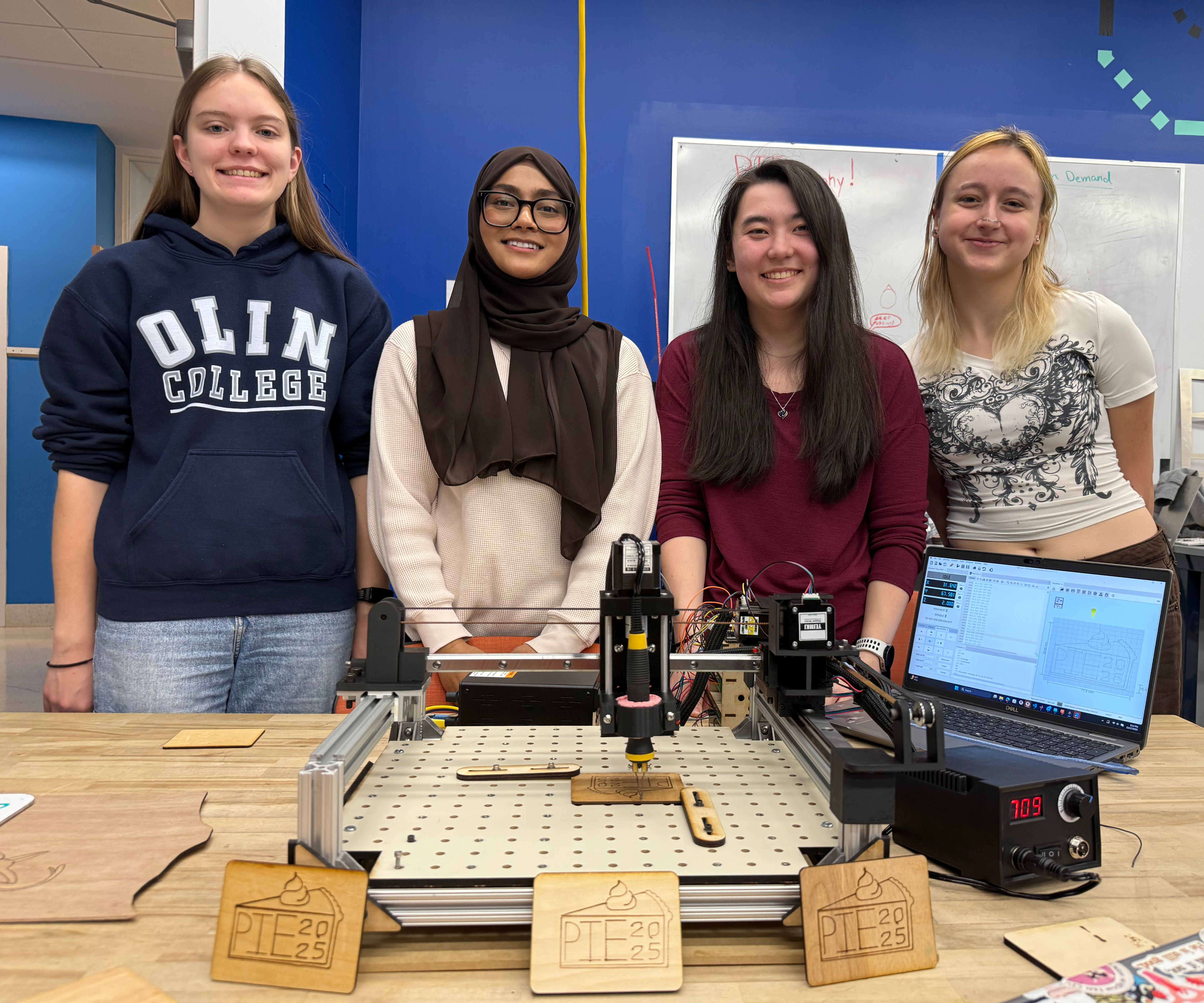 PIErography team with CNC wood burning machine
